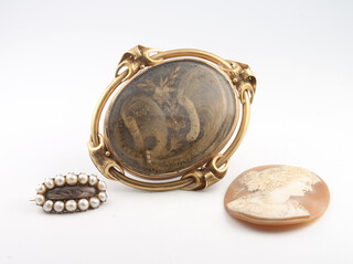 A Victorian in memoriam locket, a ditto brooch and a cameo plaque 