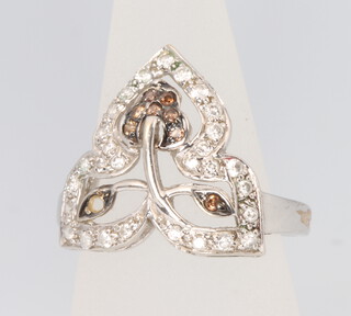 An 18ct white gold diamond and gem set set floral ring, size L 1/2, 3.7 grams 