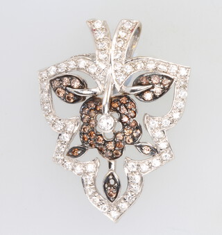 An 18ct white gold diamond and gem set floral pendant, 5.3 grams 