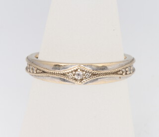 An 18ct yellow gold diamond band, size M, 3.1 grams 