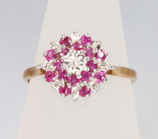 A 9ct yellow gold ruby and diamond cluster ring, size U, 2.9 grams 