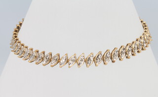 A 9ct yellow gold marquise diamond bracelet, 7.1cm