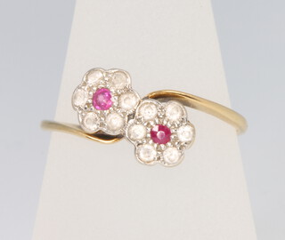 A 9ct yellow gold ruby and diamond double cluster ring, size R 1/2, 2.4 grams 