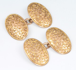 A pair of 9ct yellow gold engraved oval cufflinks, 7 grams