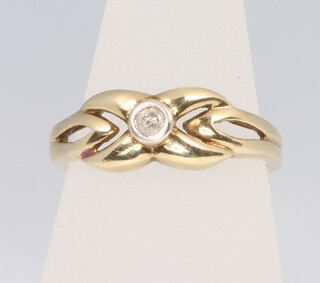 A 9ct yellow gold diamond ring, size K 1/2, 2.3 grams 