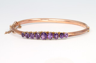 A 9ct yellow gold amethyst bangle, 5.8 grams