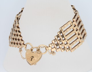 A 9ct yellow gold gate bracelet and padlock, 27.8 grams