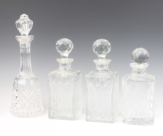 A pair of cut glass square shaped spirit decanters and stoppers 27cm, a ditto with later stopper (chipped) and a mallet ditto 