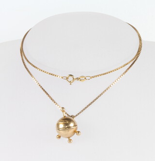 A 9ct yellow gold Sputnik pendant and chain 7.8 grams 