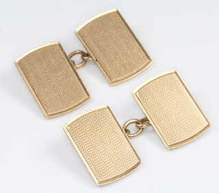 A pair of 9ct yellow gold rectangular engine turned cufflinks 6.9 grams