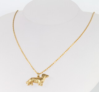 An 18ct yellow gold Dachshund pendant and chain, 6 grams 