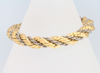 An 18ct yellow gold 2 colour twist bracelet, 32 grams 