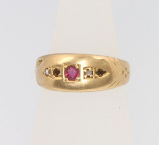 A child's 18ct yellow gold ruby and diamond ring, 1.5 grams, size B 