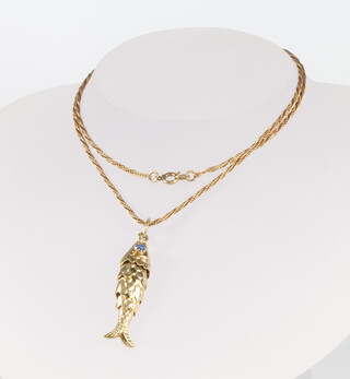 A 14ct yellow gold gem set articulated fish pendant and chain, 9.5 grams