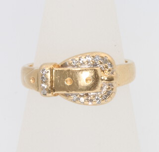 A 14ct yellow gold diamond set buckle ring, size K 1/2, 4 grams