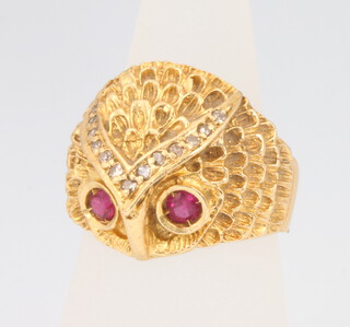 An 18ct yellow gold diamond and ruby owl ring, size J, 6.8 grams