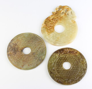 A Chinese carved hardstone disc 11cm and 2 other 