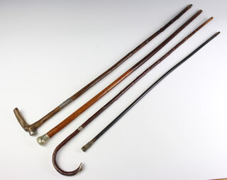 A walking stick with silver mounts and 3 others 