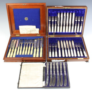 A cased set of 12 Edwardian silver plated and ivory dessert eaters, 6 silver handled butter knives and a matched cased set of 12 silver plated and mother of pearl dessert eaters 