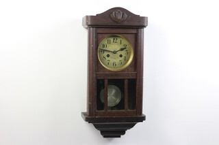 J Albert of Hirson, a 1930's chiming wall clock with silvered dial and Arabic numerals, contained in an oak case 