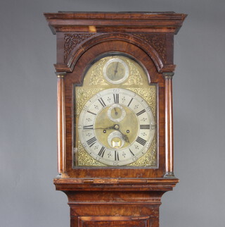 John Coates, an 18th Century 8 day striking London longcase clock with 5 pillar movement, the 29cm arched gilt dial with silvered chapter ring and Roman numerals, strike/silent indicator, subsidiary second hand and calendar aperture, contained in a walnut case, complete with weights and pendulum, 221cm h 
