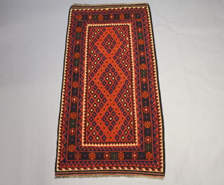 A black and blue ground Ghalmori Kilim with central field within a multi row border 210cm x 107cm 