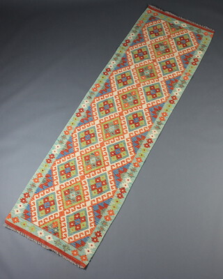 A green turquoise, yellow and white ground Cobi Kilim runner 260cm x 78cm 