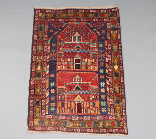 A red, blue and green belouche pictorial prayer rug within a multi row border 125cm x 86cm 