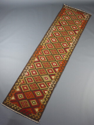 A red, brown and tan Maimana kilim runner with all over geometric design 295cm x 80cm 