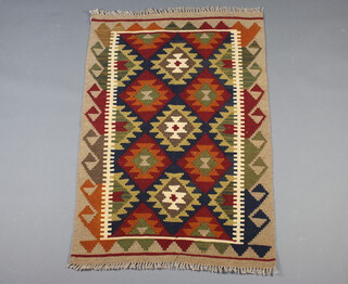 A brown, black and green ground Maimana  Kilim rug with all over geometric designs 124cm x 84cm 