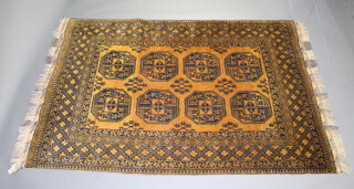 A brown ground Afghan rug with 8 stylised octagons to the centre 254cm x 163cm 
