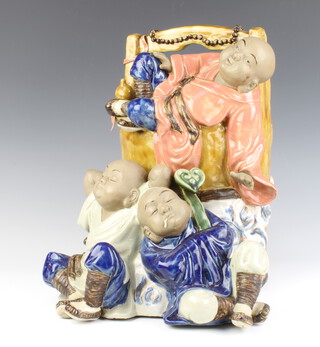 A modern Chinese earthenware group of 3 figures beside a giant pail 33cm 