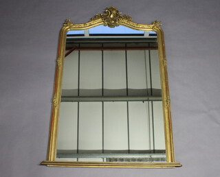 A Victorian arched plate over mantel mirror contained in a decorative gilt frame 170cm h x 108cm w