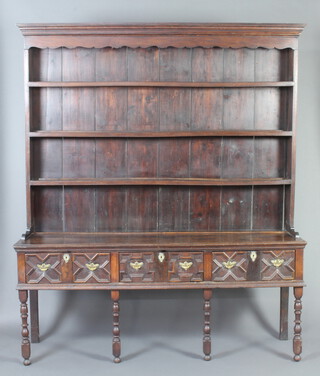 A Georgian oak dresser, the raised back fitted 3 shelves and with moulded cornice, the base fitted 3 drawers with geometric mouldings and brass swan neck drop handles, raised on 4 turned and block supports 235cm x 190cm w x 48cm d 