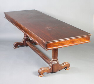 A late 19th Century rectangular mahogany library table, raised on 2 turned columns with H framed stretcher and tripod base 72cm h x 206cm l x 76cm w  
