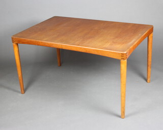 H W Klein for Bramin, a Danish mid 20th Century teak extending dining table with extra leaf, raised on turned supports, the base with sticker marked Design Baramin Denmark and stencilled 7311, 72cm h x 136cm l x 89cm w (some stain marks to the top) 
