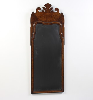 A Queen Anne style arched plate mirror contained in a walnut frame 94cm h x 36cm w 