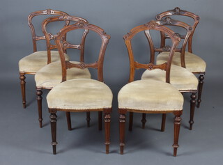 A harlequin set of 6 Victorian carved walnut spoon back dining chairs with carved mid rails and over stuffed seats, raised on turned and fluted supports, comprising 3 pairs of chairs 