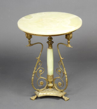 An Empire style circular onyx and gilt metal pedestal occasional table raised on column swan supports, triform base and paw feet 58cm h x 45cm diam. 