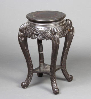 A circular Chinese ebonised 2 tier jardiniere stand with Grecian key decoration, raised on cabriole supports 61cm x 32cm 