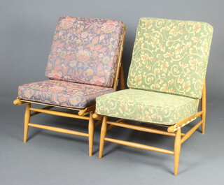 Ercol, a pair of mid Century light turned beech framed nursing chairs with upholstered seats and backs 