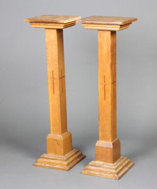 A pair of ecclesiastical rectangular oak pedestals raised on square stepped supports 92cm h x 26cm w x 21cm d 