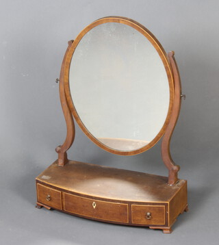 A 19th Century Sheraton style oval plate dressing table mirror contained in a mahogany swing frame, the bow front base fitted 3 drawers, raised on bracket feet 62cm h x 47cm w x 21cm d 
