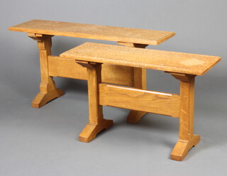 A rectangular light oak Arts and Crafts style stool with standard end supports and H framed stretcher 50cm x 101cm x 27cm together with one other 49cm h x 80cm w x 29cm d 
