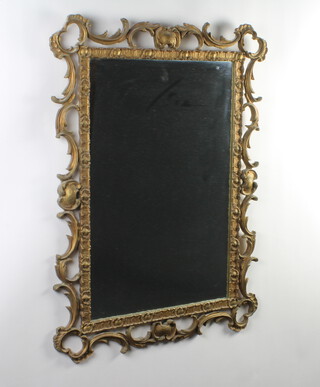 An Italian style rectangular plate mirror contained in a decorative gilt frame 99cm h x 74cm w

