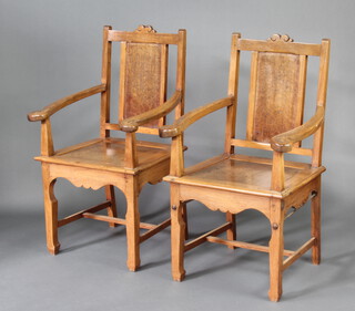 A pair of Oriental hardwood and figured walnut slat back open arm chairs with solid seats, raised on square supports with H framed stretchers 