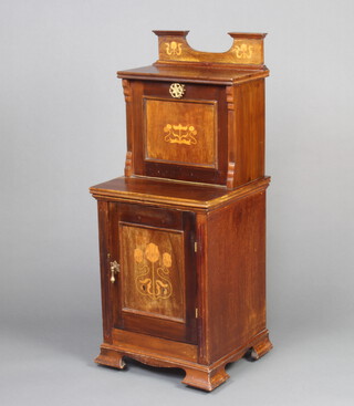 An Edwardian Art Nouveau inlaid mahogany coal purdonium with raised back, the upper section fitted a cupboard with shelf and fall front, the base enclosed by a panelled door, raised on bracket feet 100cm h x 41cm w x 37cm, split to the top of the base 