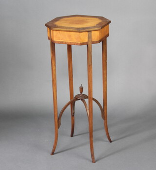 A Georgian octagonal crossbanded satinwood occasional table with outswept supports and X framed stretcher 77cm h x 33cm w x 33cm d 