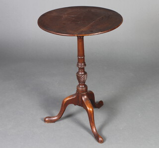 A 19th Century circular mahogany wine table, raised on a turned column and tripod base 69cm h x 47cm diam. 