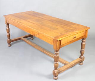 A 19th Century oak dining table fitted a drawer, raised on turned supports with H framed stretcher 73cm h x 176cm w x 75cm d 